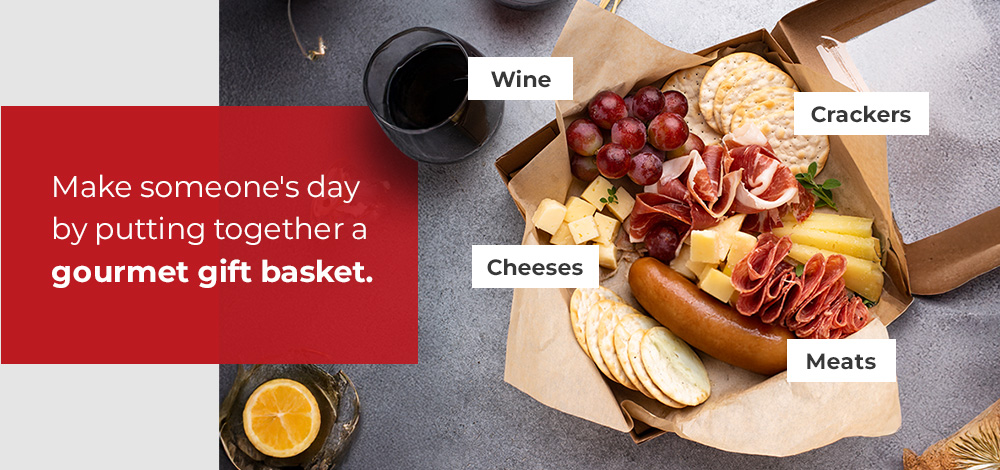 Gourmet gift basket with cheese, crackers, meat, and wine